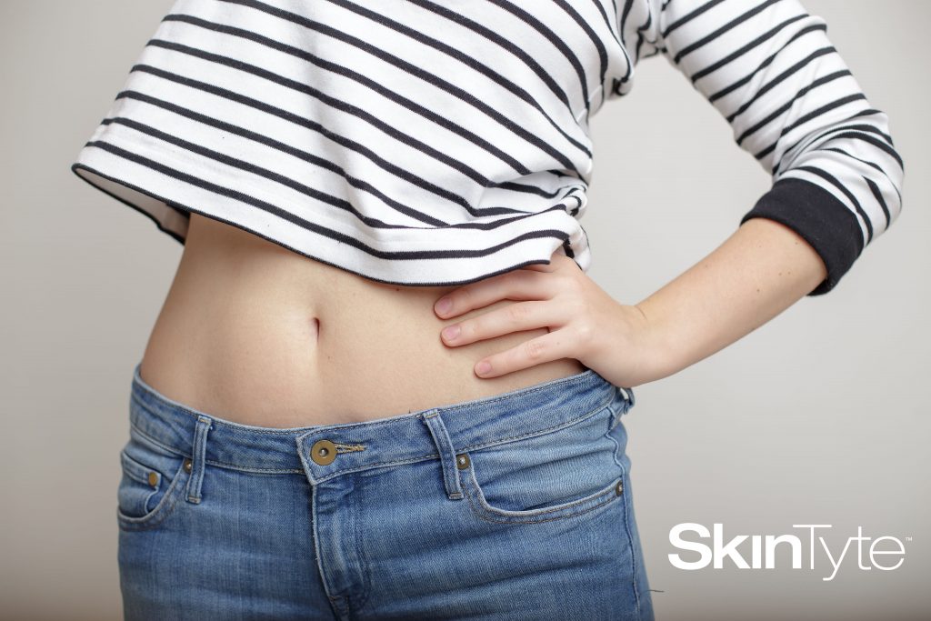 Woman with tight stomach