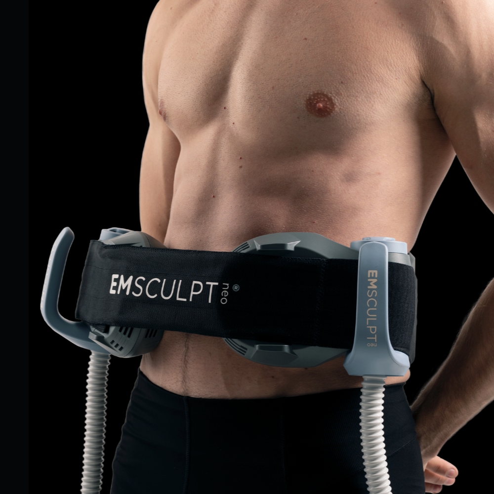 Shirtless man's abdomen is worked out with Emsculpt Neo treatment.